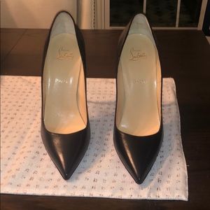 Christian Louboutin black leather pumps.